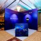 Event exhibits with booths and displays set up at a corporate exhibition.